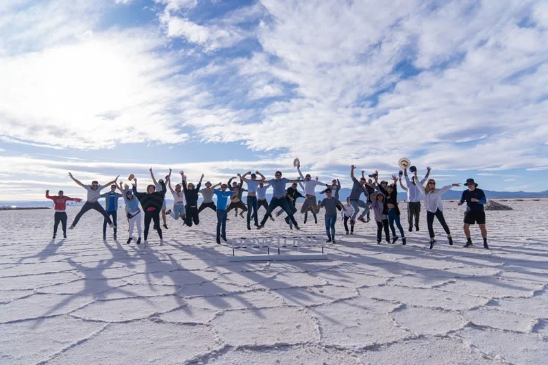 The Newtopia community jumping on the salt flats of Salinas Grandes
